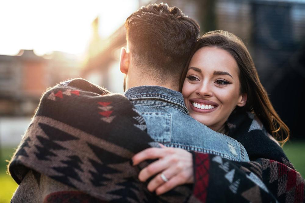 Woman hugging her boyfriend near 75078