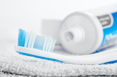 Close up of a tooth brush and tooth paste at Prosper Smile Family Dentistry in 75078