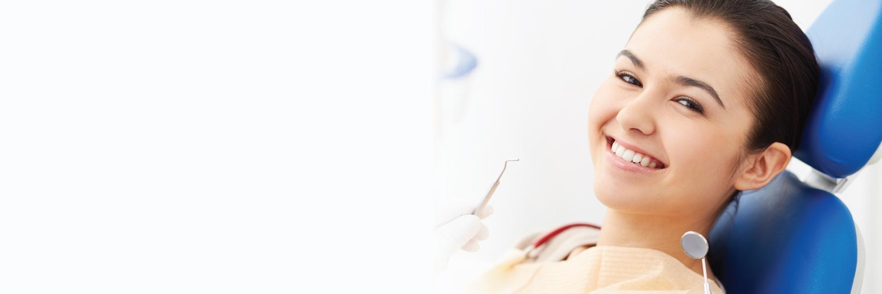Woman waiting at dentist office in Prosper, TX for a root canal | Prosper Smiles 