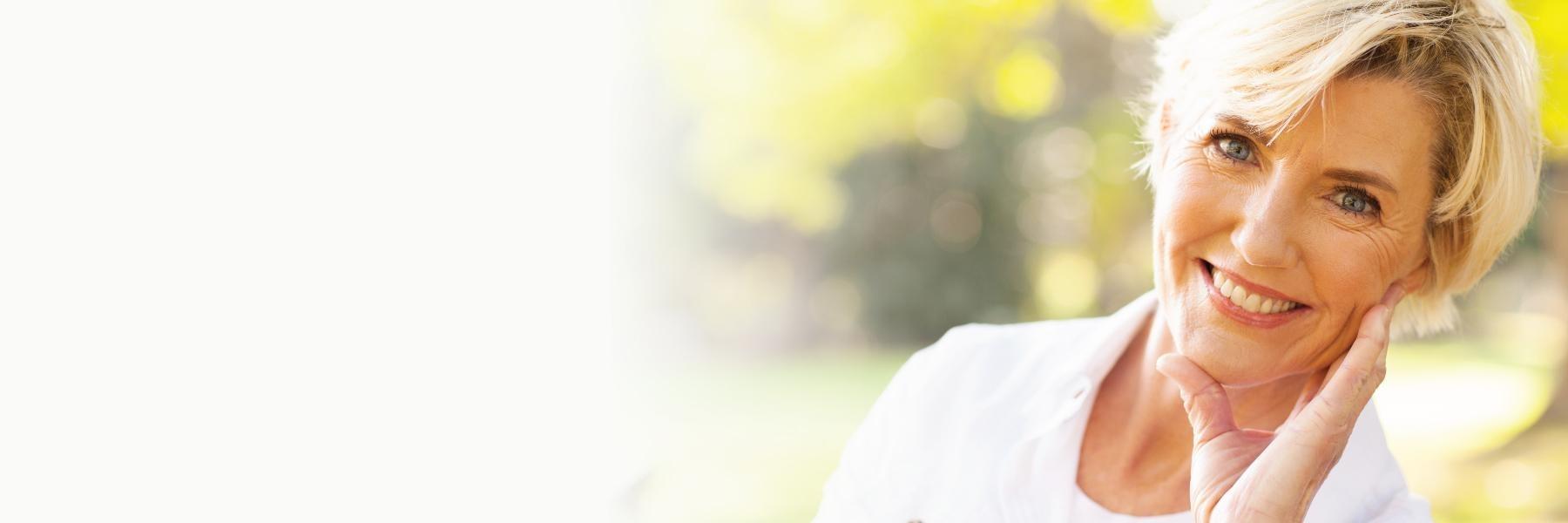 older blonde woman smiling l pediatric dentistry prosper tx