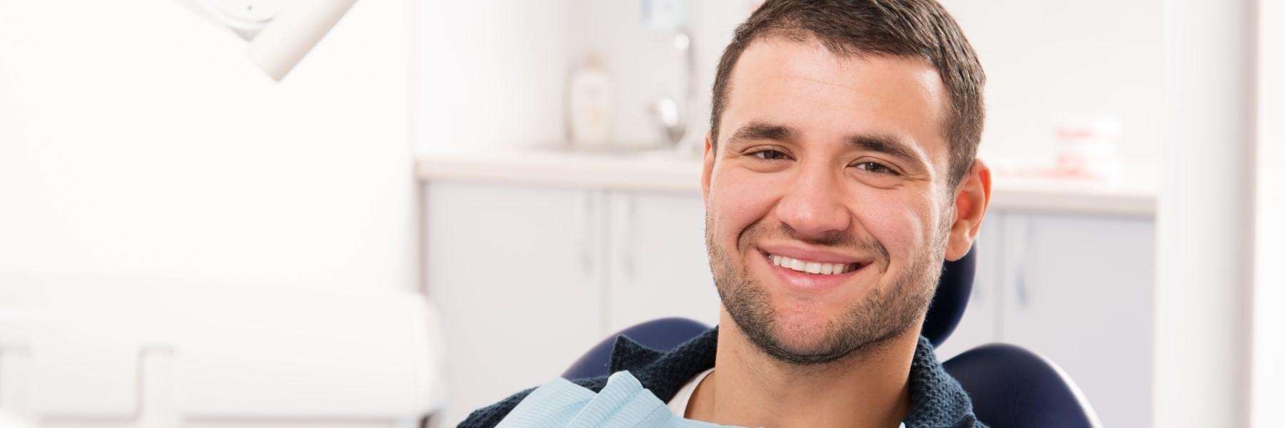 A man smiling in Prosper TX dental office