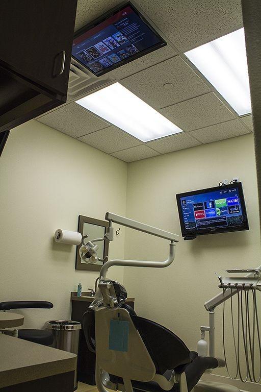 TV inside of patient treatment room at dentist office in Prosper TX
