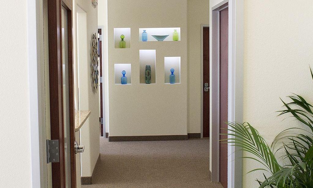 Hallway of treatment rooms at dentist office in 75078